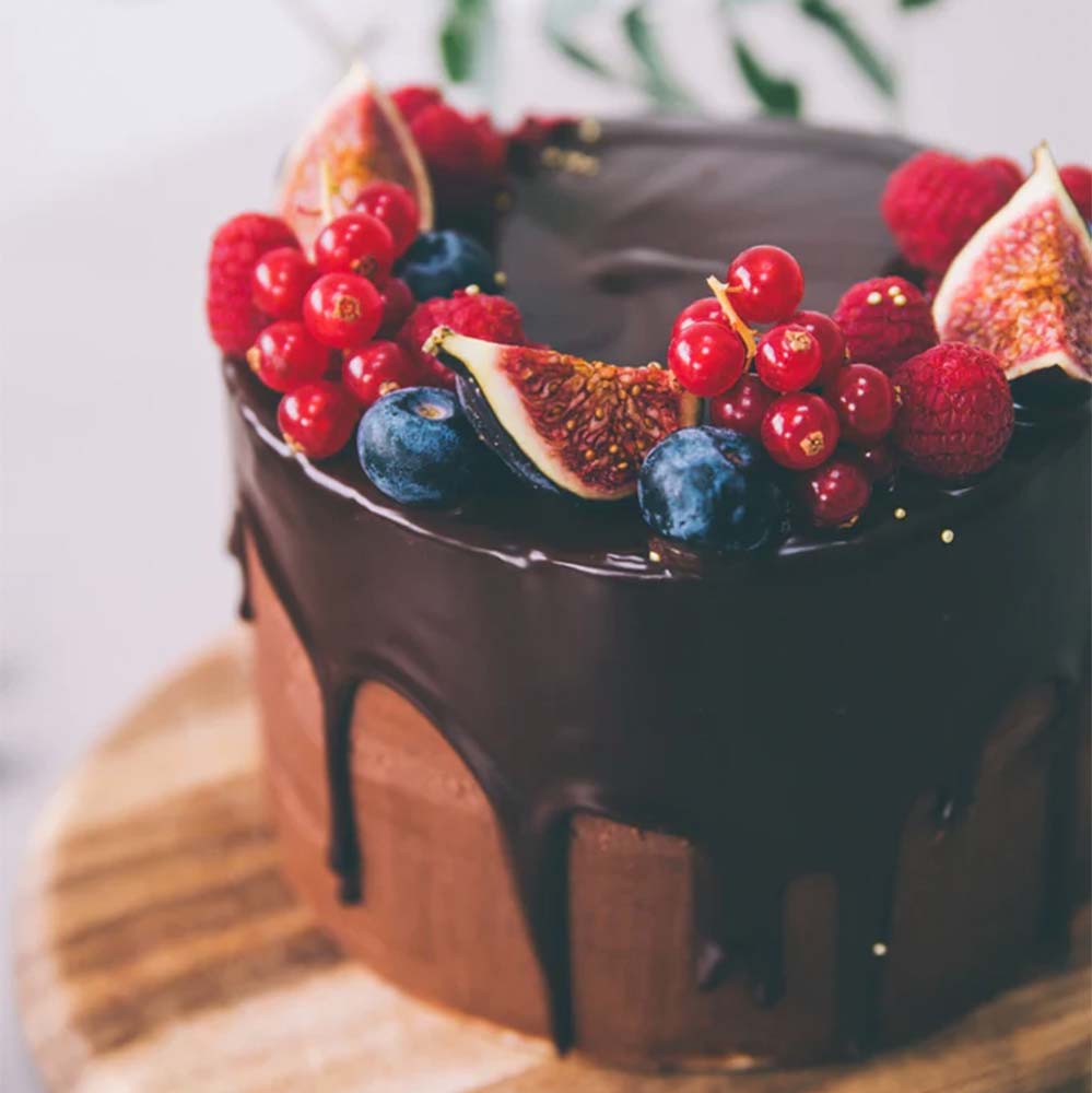 Chocolate drip cake with Arc of Berries